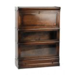 Property of a deceased estate - an oak Globe Wernicke three section stacking bookcase with drawer