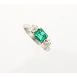 A platinum certificated untreated Colombian emerald & diamond three stone ring, the octagonal cut