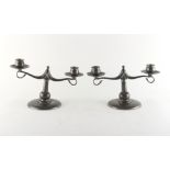 Property of a deceased estate - a pair of Liberty & Co. Tudric pewter twin light candelabra, pattern