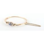 A late 19th / early 20th century 14ct yellow gold sapphire & diamond hinged bangle, the octagonal