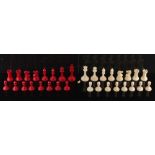 Property of a lady - a red stained & natural ivory Staunton pattern chess set, complete, the kings