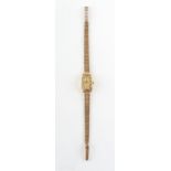 Property of a deceased estate - a lady's Omega De Ville wristwatch with 9ct gold bark effect