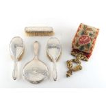 Property of a deceased estate - a silver backed four piece dressing table mirror & brush set;