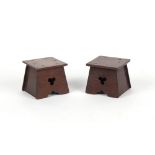Property of a lady - a pair of early 20th century Arts & Crafts walnut square stands, each with