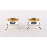 Property of a deceased estate - a pair of George II silver cauldron salts, with gilt interiors,