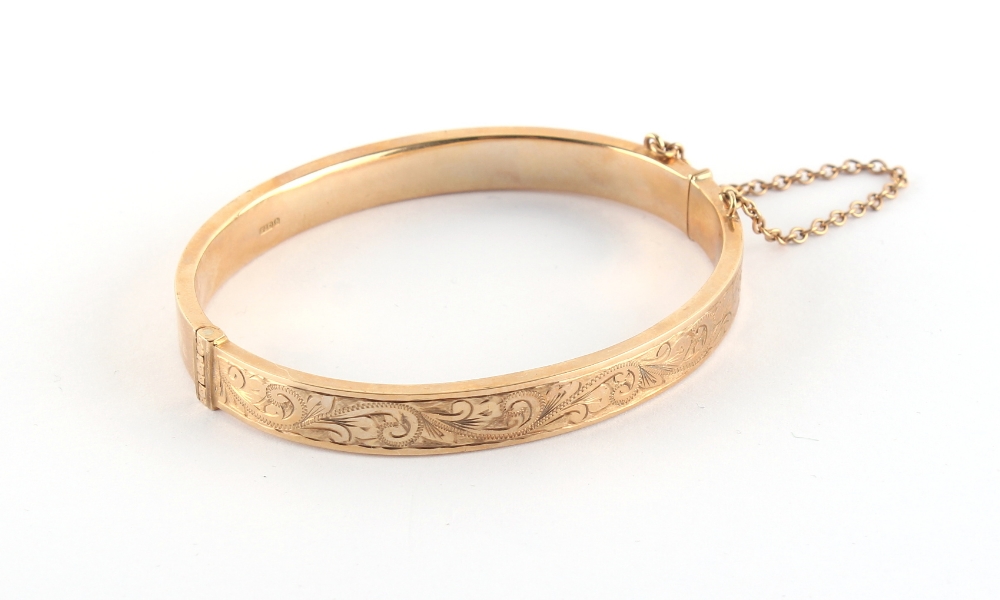 Property of a deceased estate - a 9ct gold hinged bangle, approximately 12.8 grams.