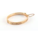 Property of a deceased estate - a 9ct gold hinged bangle, approximately 12.8 grams.