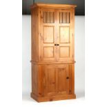Property of a lady - a modern pine two part bacon cupboard, 88ins. (224cms.) high, 39.25ins. (