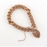 Property of a lady - a 9ct gold chain link bracelet with heart clasp, approximately 18.8 grams.
