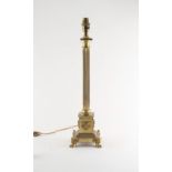 Property of a lady of title - a gilt brass Corinthian column table lamp, one paw foot stamped '