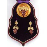 A Victorian garnet vine & grapes brooch & earrings suite or demi parure, with oval cut garnets,