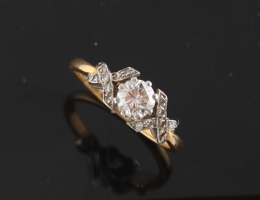 Property of a lady - an unmarked yellow gold diamond single stone ring, the round brilliant cut