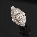 An Art Deco style diamond ring, set with a row of three round brilliant cut diamonds flanked by