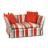 Property of a lady - a modern knole sofa with striped upholstery.