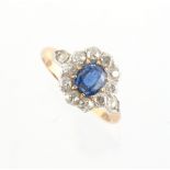 Property of a lady - an unmarked early 20th century yellow gold sapphire & diamond cluster ring, the
