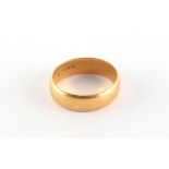 Property of a deceased estate - a 22ct gold wedding band, approximately 5.3 grams, size N.