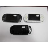 Three Sony PSP Handheld Gaming Consoles, (two white, one black), playworn, untested.