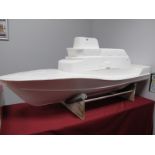 A Glass Fibre Bodyshell, in the form of a model cruiser boat, unpainted, ideal starter project,