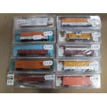 Ten Atlas 'N' Gauge Cased U.S.A Outline Items of Rolling Stock, Caboose, Box Vans, Open Wagons, etc,