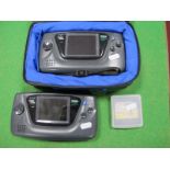 Two Sega Game Gear Portable Video Game Systems, Super Kick Off Game cartridges, soft carry case,