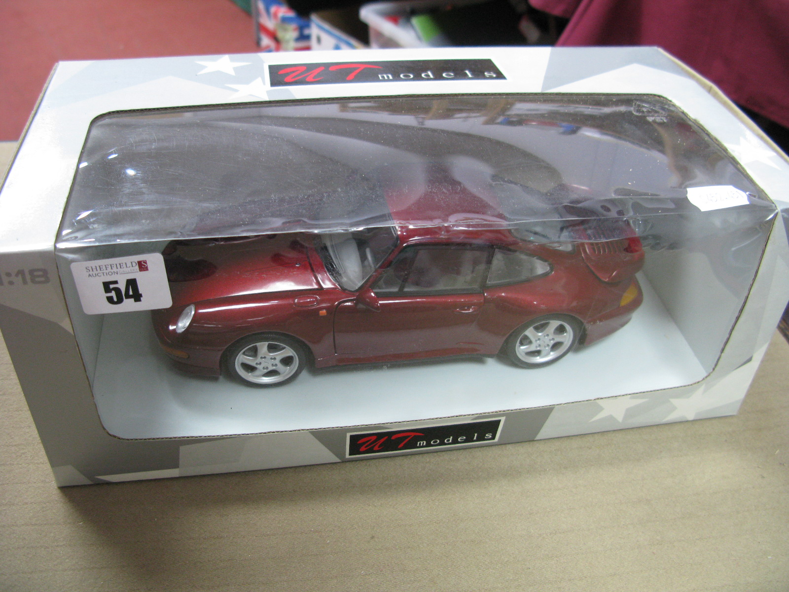 A UT Models 1:18th Scale Diecast Model Porsche 911 Turbo, metallic burgundy paint work boxed.