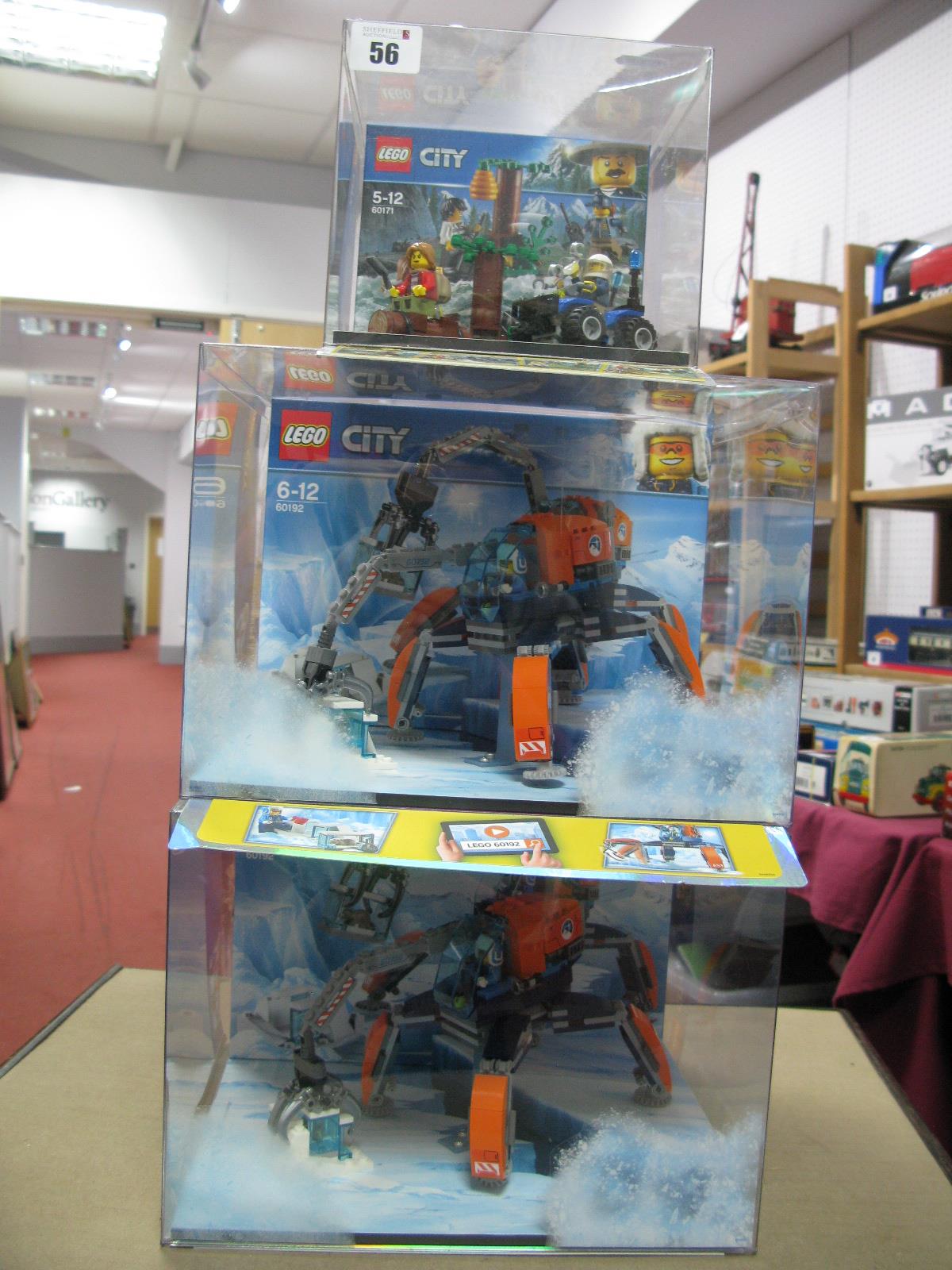 Three Lego City Shop Display Units, including #60192 Artic Ice Crawler, (2) #60171 Mountain