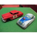 A 1950's Plastic Police Car, by Marx, friction drive, red plastic, 24cm long, plus a tinplate police