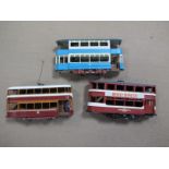 Three 'OO'' Gauge/4mm Motorized Kit Built Double/Deck Tram Cars: two plastic, one white metal-