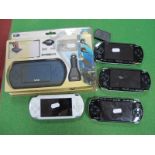Four Sony PSP Handheld Gaming Consoles, (three black, one white), screen damage noted to one PSP,