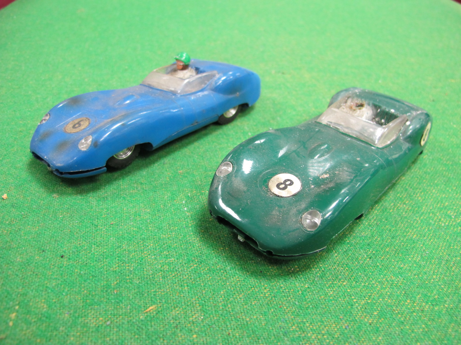 Two 1960's Scalextric Lister Jaguars, one green, one blue, both playworn.