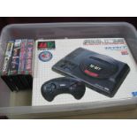 A Sega Mega Drive 16 Bit Gaming Console, including control pad original box; together with four