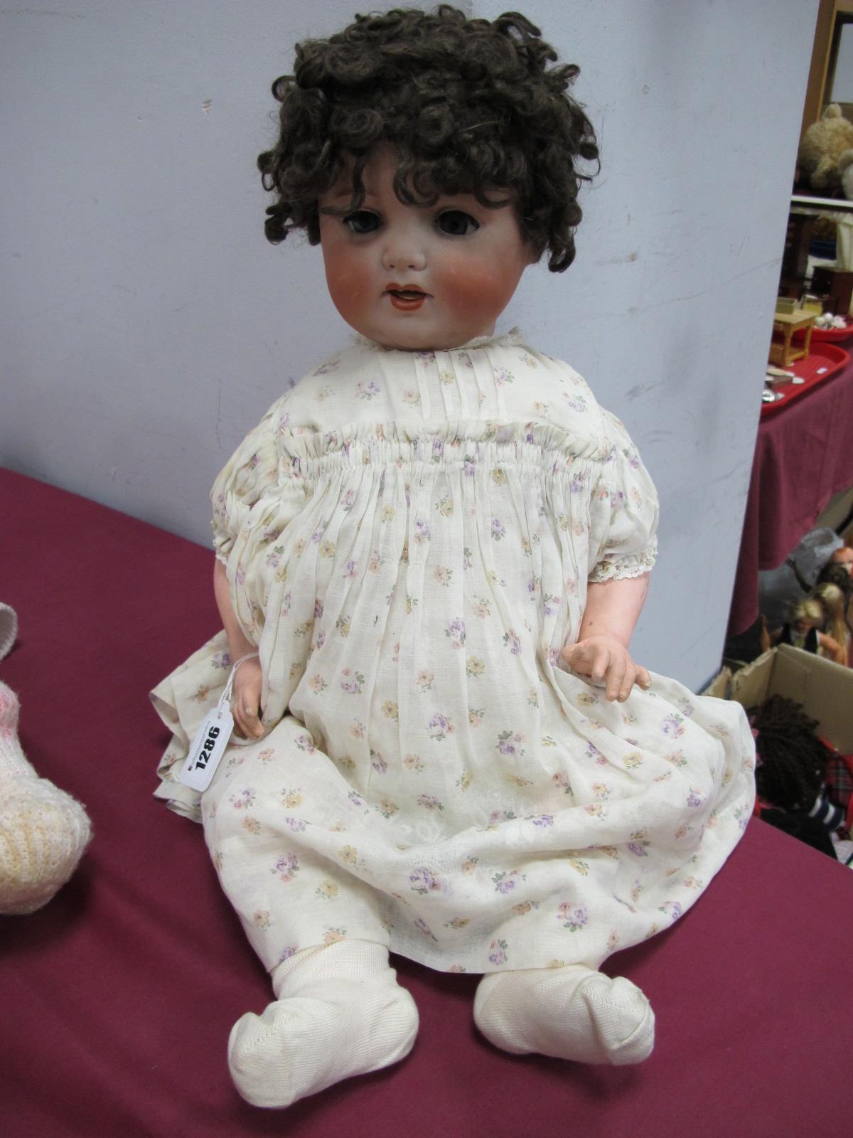 An Early XX Century Bisque Headed Doll, by Armand Marseille, head stamped 996 A.12.M, sleepy eyes,