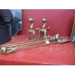 A Pair of Brass Fire Dogs, with ball and claw finials and pad feet, three matching fire irons. (5)