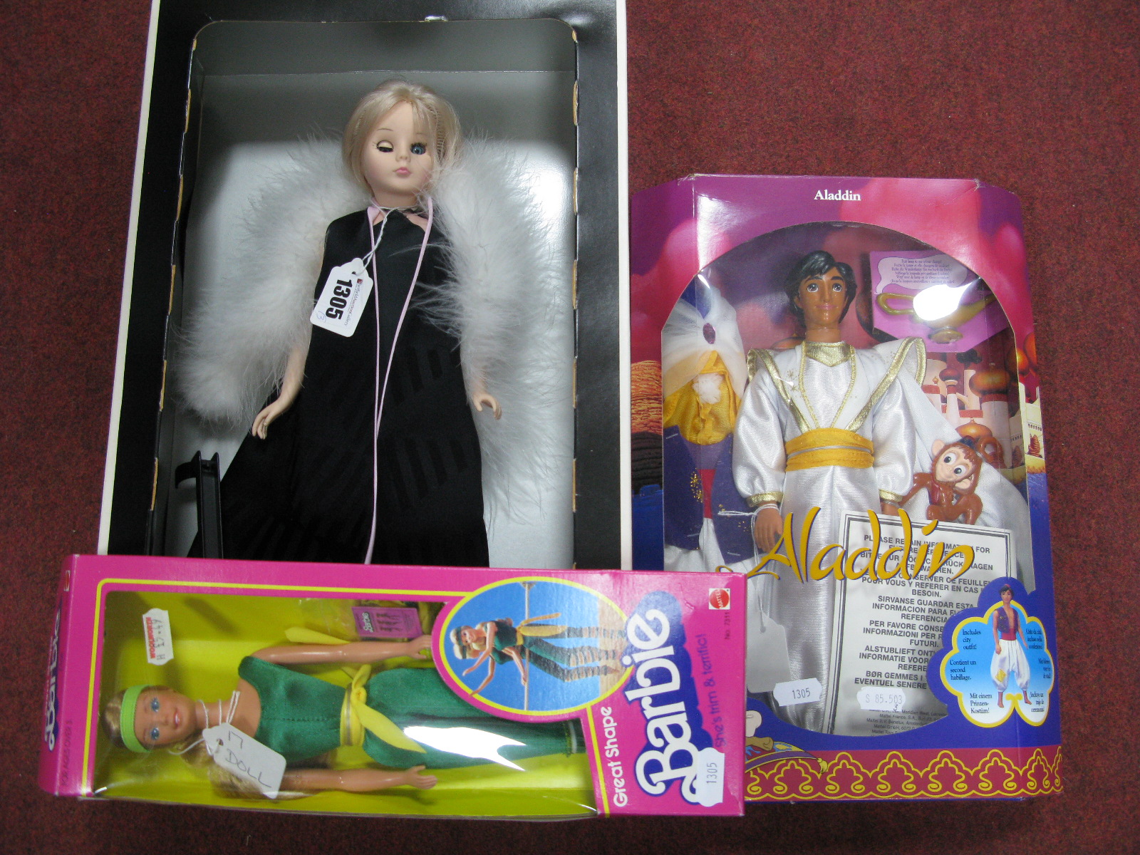 Three Boxed Modern Dolls, including "Miss Pedigree", "Great Shape Barbie" and Disney "Aladdin".