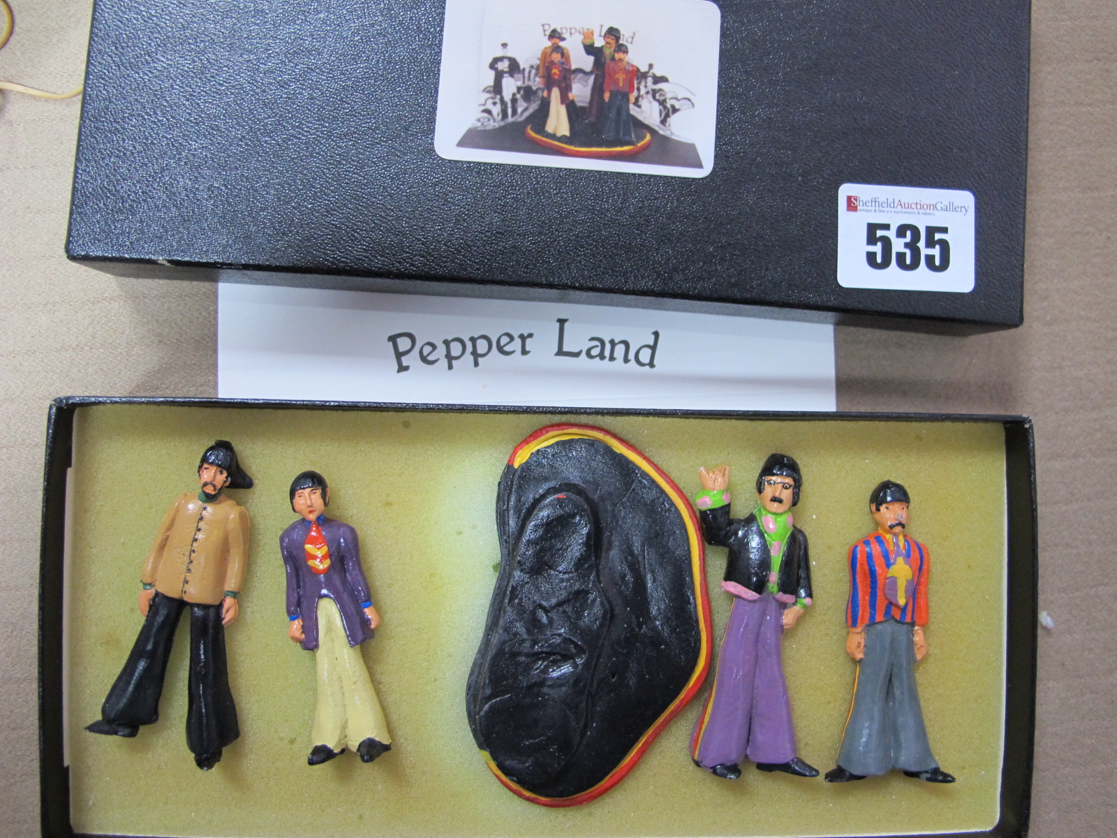 Beatles Interest: A set of four Beatles white metal figures, 'Pepper Land', boxed