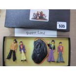 Beatles Interest: A set of four Beatles white metal figures, 'Pepper Land', boxed