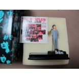 A Modern 'The Beatles' Paul McCartney Figurine, by Enesco with album cover, boxed.