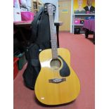 A Yamaha F-310 Acoustic Guitar, with soft carry case, floor stand.