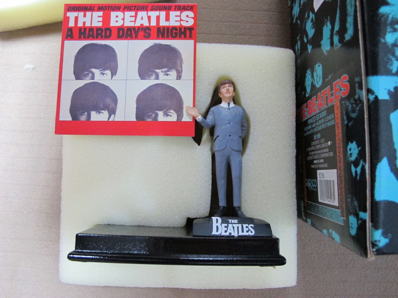 A Modern 'The Beatles'Ringo Starr Figurine, by Enesco with album cover, boxed.