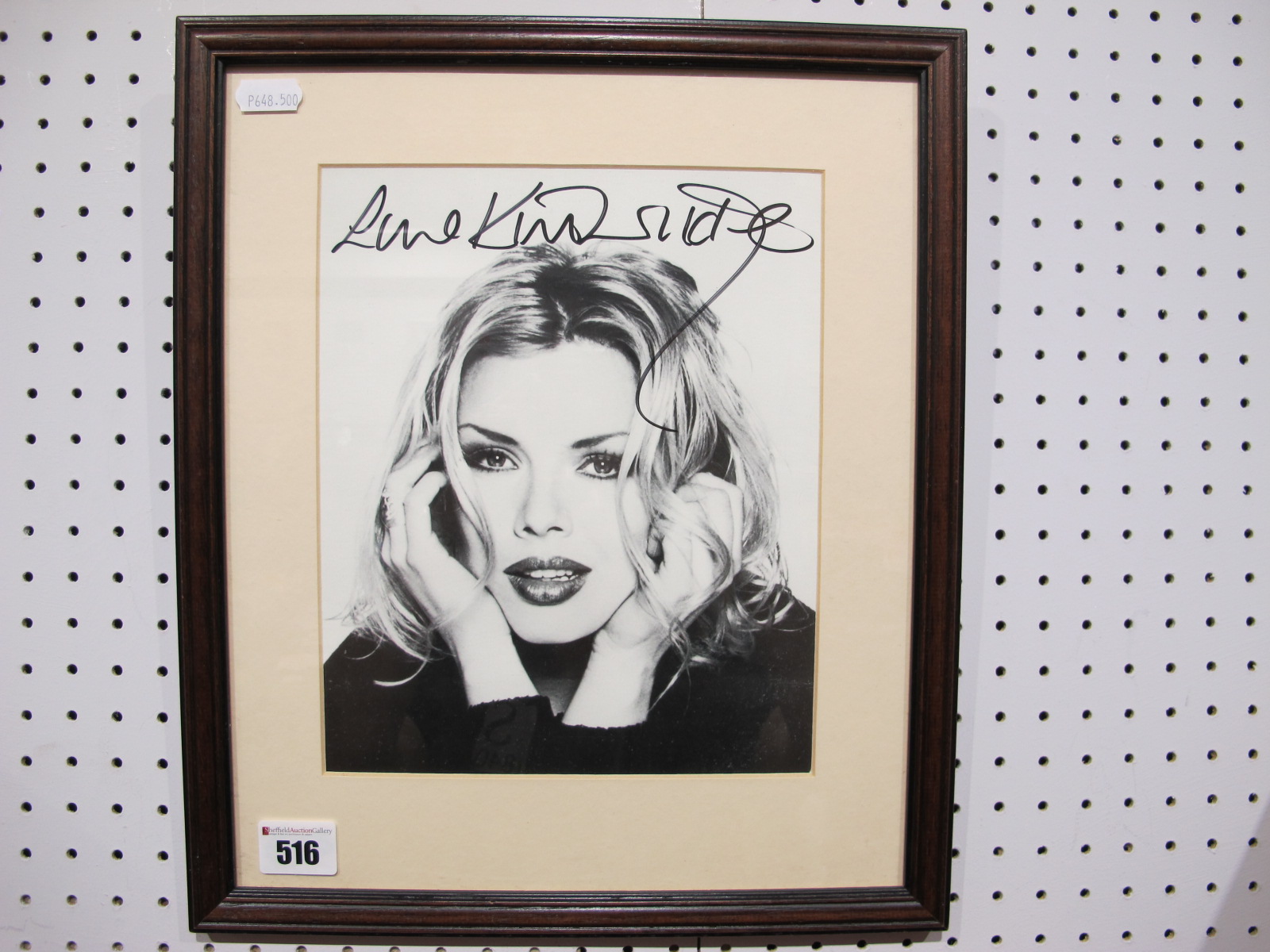 A Framed Black and White Signed Photograph of Kim Wilde, (unverified), 30.5 x 36cm.