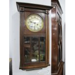 1940's Oak Cased Wall Clock, with a circular dial, Arabic numbers, glazed door.