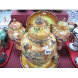 A Matched Pair of Hose St Pottery Urns and Covers, painted with fruit on a thumbprint ground,