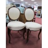 Set of Four XIX Century Walnut Salon Chairs, having rose carved cresting, re-upholstered in a