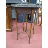 Bronzed Circular Topped Plant Stand, with pierced galley on bamboo effect folding base.