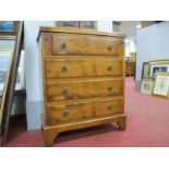 A Yew Wood Batchelors Chest of Drawers, with a fold over top, four long drawers, on bracket feet.