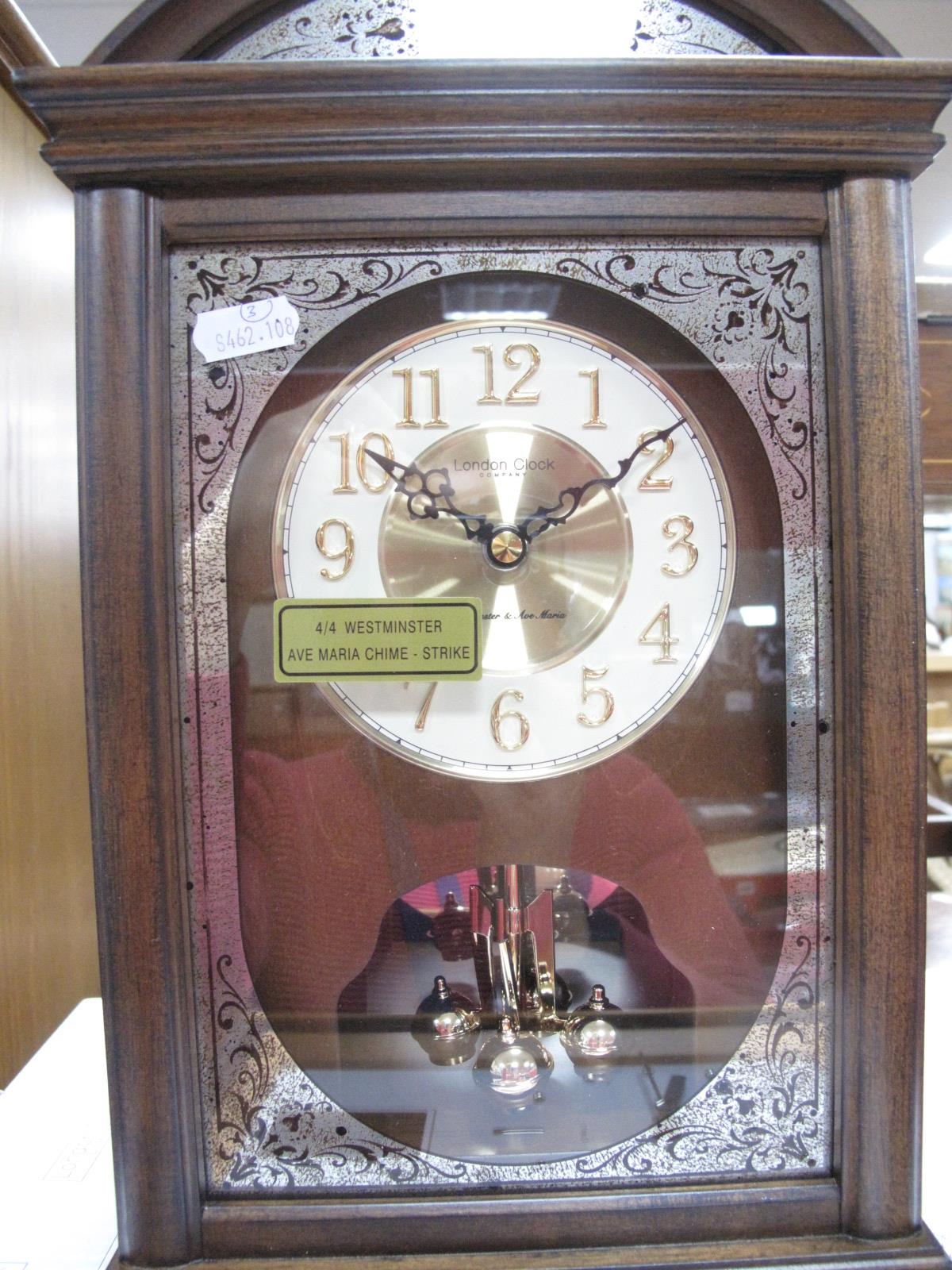 A "London Clock" Antique Style Mantel Clock, boxed; together with an Art Deco style wall clock