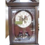 A "London Clock" Antique Style Mantel Clock, boxed; together with an Art Deco style wall clock