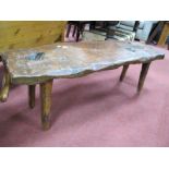 A Coffee Table of Naturalistic Form, with tree trunk top on tapering legs 118cm wide.