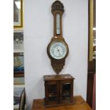 An Early XX Century Oak Smokers Cabinet, glazed doors, two small drawers, mixing bowl, together with