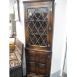 Oak Double Corner Cupboard, with a leaded door, two internal shelves, panelled cupboard door, on